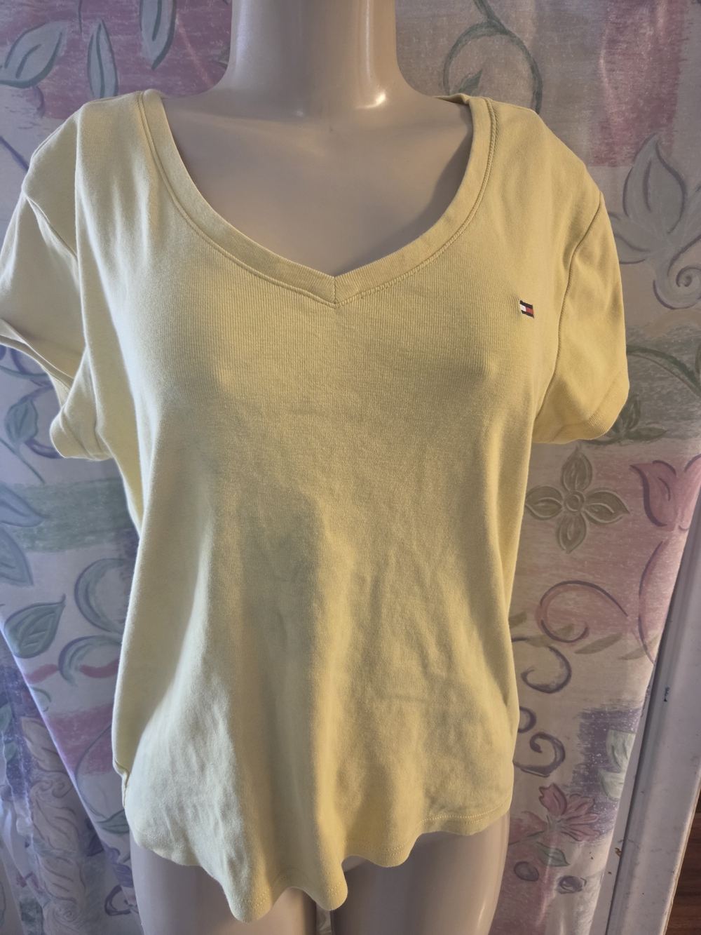 yellow Tommy Hilfiger V-neck t-shirt featuring the brand's signature small embro